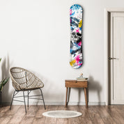 Glass wall art featuring a snowboard design by Artdesigna, showcasing a sleek, modern snowboard graphic on clear glass.
