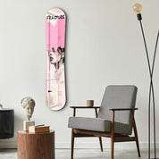 Pink grunge portrait glass wall art featuring a snowboard-themed design by Artdesigna, mounted on a sleek glass surface.