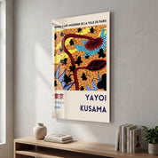 Glass wall art featuring Yayoi Kusama's floral butterflies design, vibrant Japanese pop art by Artdesigna.