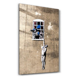 Banksy - Man hanging from a window | Glass Wall Art