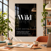 Wild Definition glass wall art by Artdesigna, black and white typography print in a home office