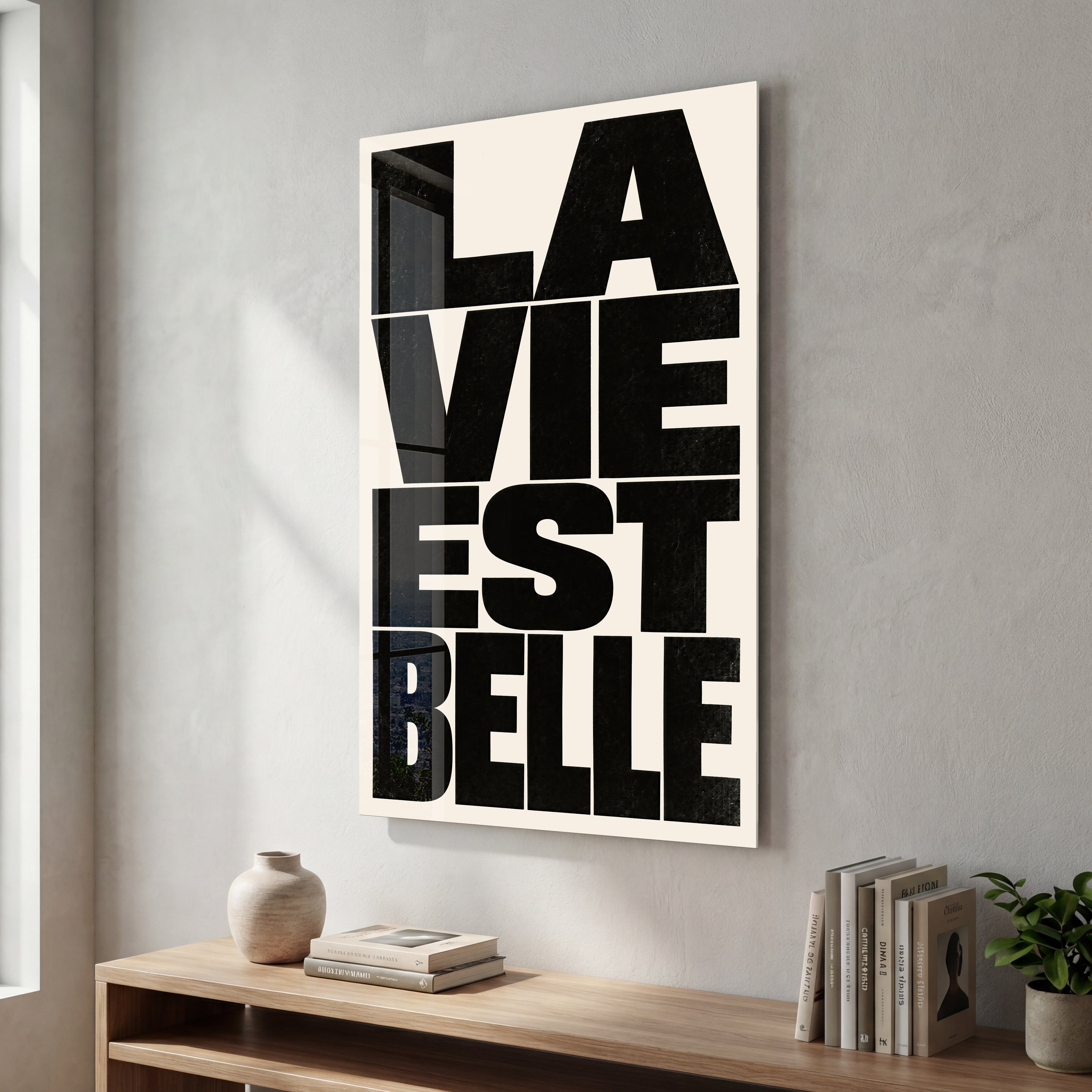 La Vie Est Belle glass wall art by Artdesigna, featuring elegant decorative lettering on a glass panel