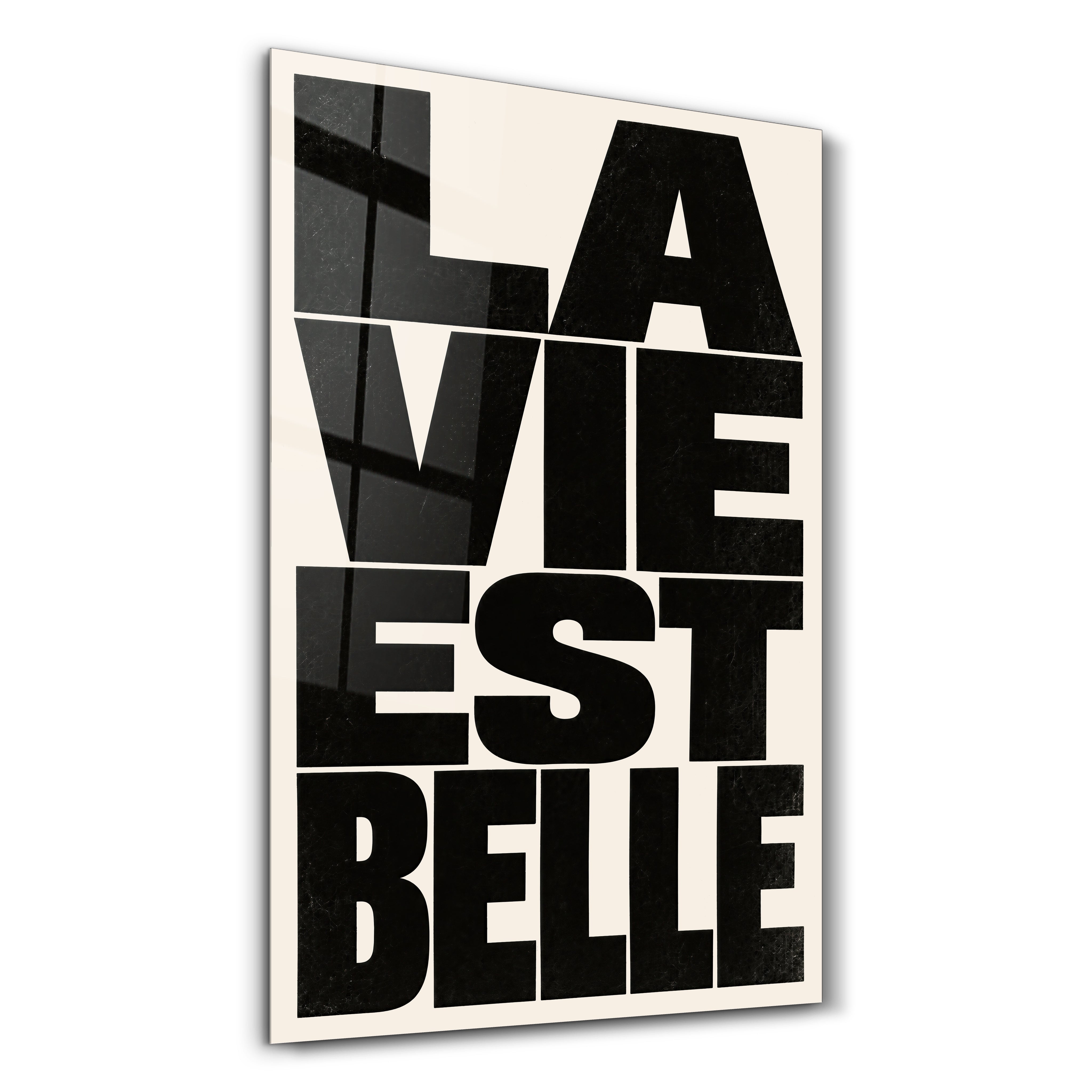 La Vie Est Belle glass wall art by Artdesigna, featuring elegant typographic design on glass panel