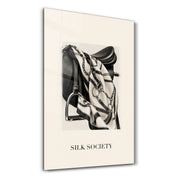Artdesigna Silk Society glass wall art with elegant silk-inspired design in a studio setting
